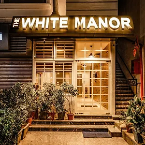 Tripli White Manor Hotel